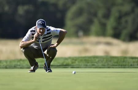 Aug 25, 2016; Farmingdale, NY, USA; Jim Furyk reads the green on the 10th hole during the first round of The Barclays golf tournament at Bethpage State Park - Black Course. Mandatory Credit: Eric Sucar-USA TODAY Sports