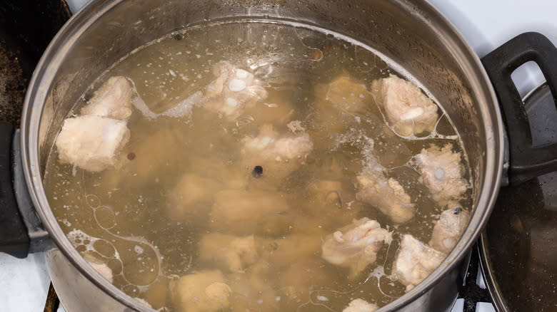 Meat cooking in broth