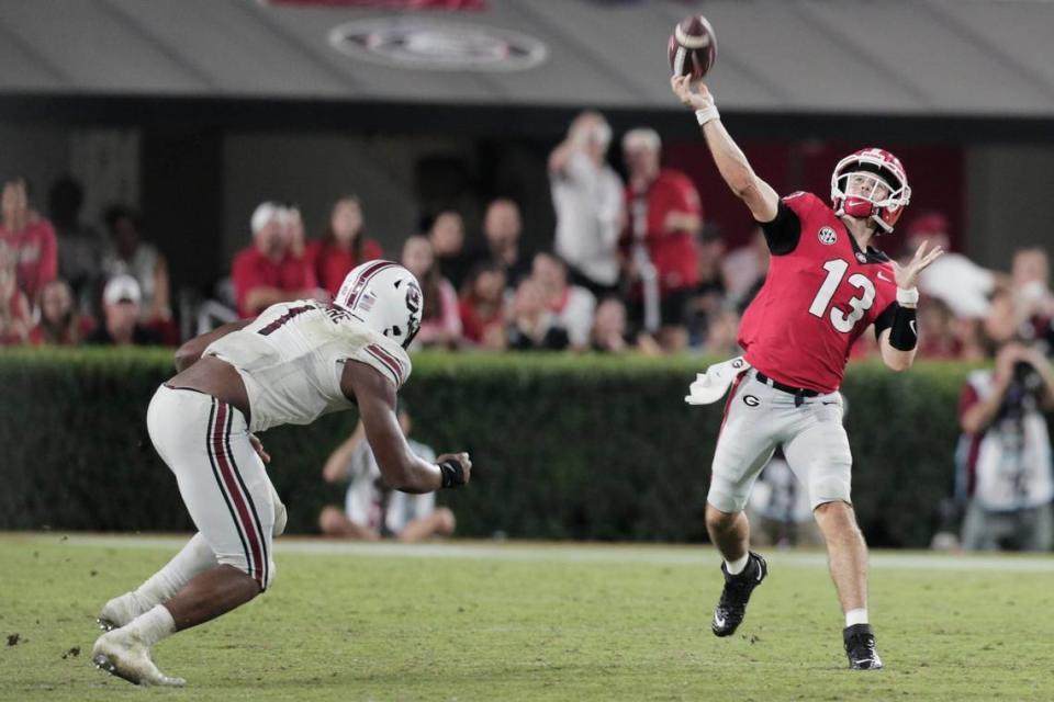 South Carolina Gamecocks defensive end Kingsley Enagbare (1) tried to get to Georgia quarterback Stetson Bennett (13) last week in the Gamecocks’ 40-13 loss to the Bulldogs at Sanford Stadium.