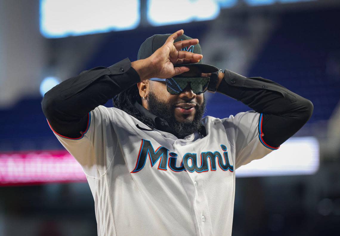 Johnny Cueto, Miami Marlins new right-handed pitcher, puts on his new cap after being welcomed to the team on Thursday, Jan. 19, 2023, at loanDepot Park.