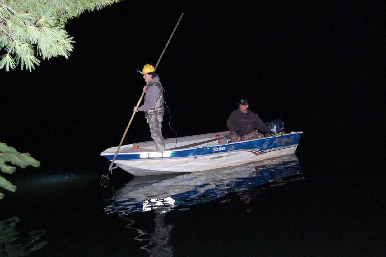 William Poupart and his father, Duane Poupart, who are Lac du Flambeau tribal citizens, head out on Carrol Lake in Vilas County to spearfish.