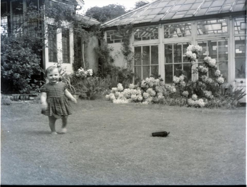 One of the Lathams’ four grandchildren in the property’s garden (Aston Chase/Tony Murray Photography)