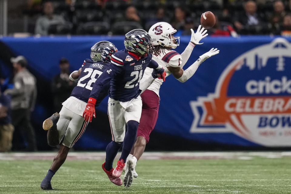 Dec 18, 2021; Atlanta, GA, USA; South Carolina State Bulldogs wide receiver Shaquan Davis (1) makes a catch against Jackson State Tigers defensive backs Randall Haynie (28) Shilo Sanders (21) during the second half of the 2021 Celebration Bowl at Mercedes-Benz Stadium. Mandatory Credit: Dale Zanine-USA TODAY Sports