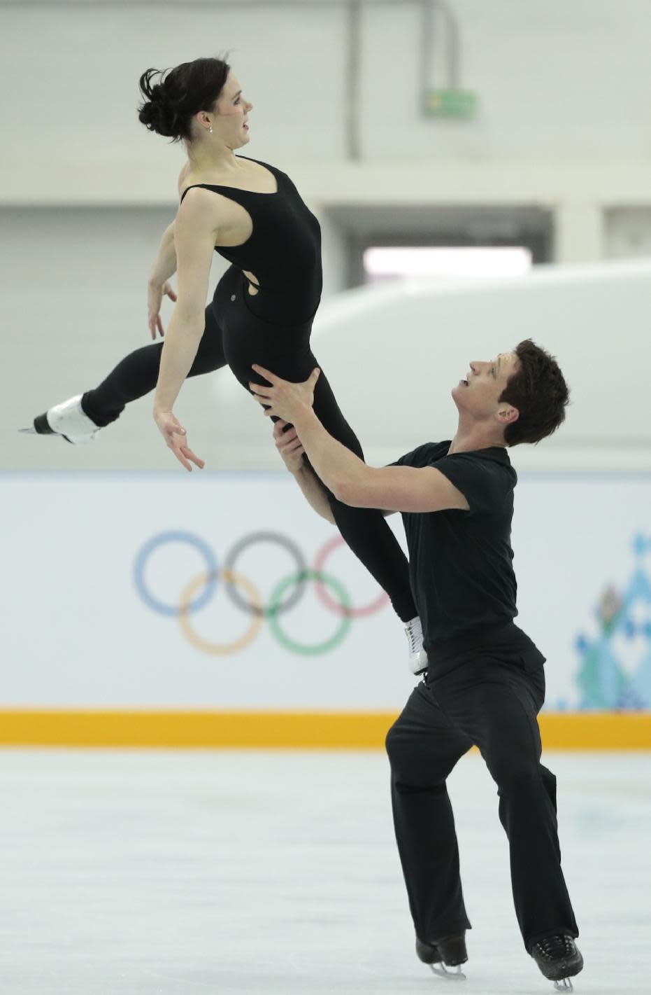 Canada's Tessa Virtue and Scott Moir skate at the figure skating practice rink ahead of the 2014 Winter Olympics, Wednesday, Feb. 5, 2014, in Sochi, Russia. (AP Photo/Ivan Sekretarev)