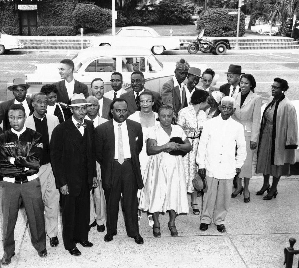 Inter-Civic Council leaders wait outside City Hall in Tallahassee, Fla. on Oct. 17, 1956 for the start of their trial on charges of operating illegal car pool to transport  African Americans  boycotting buses in segregated seating protest. Rev. C.K. Steele, council President, is second from left in front row.