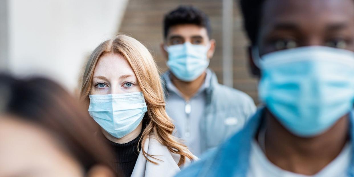 people wearing covid masks in the street