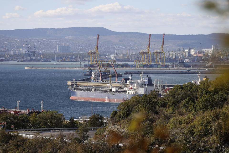 FILE - An oil tanker is moored at the Sheskharis complex, part of Chernomortransneft JSC, a subsidiary of Transneft PJSC, in Novorossiysk, Russia, on Oct. 11, 2022, one of the largest facilities for oil and petroleum products in southern Russia. After a year of far-reaching sanctions aimed at degrading Moscow's war chest, economic life for ordinary Russians doesn't look all that different than it did before the invasion of Ukraine. (AP Photo, File)