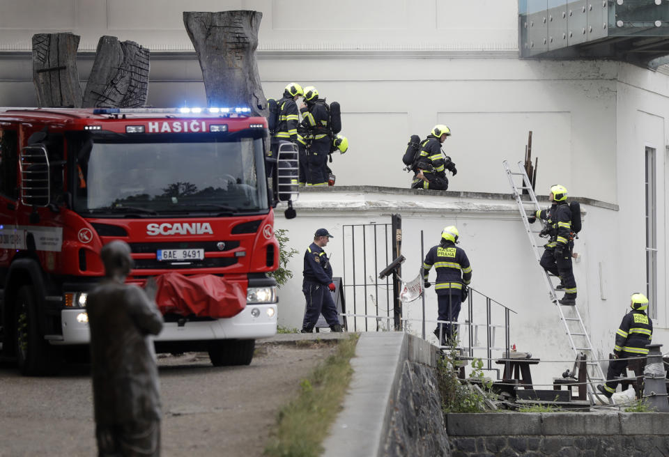 Firefighters take control of a fire in a technical building of the Kampa Museum in Prague, Czech Republic, Wednesday, July 15, 2020. It was immediately not clear if any of the art pieces were damaged. Kampa Museum is known for its valuable collections of paintings by Frantisek Kupka, a pioneer of modern abstract painting. (AP Photo/Petr David Josek)