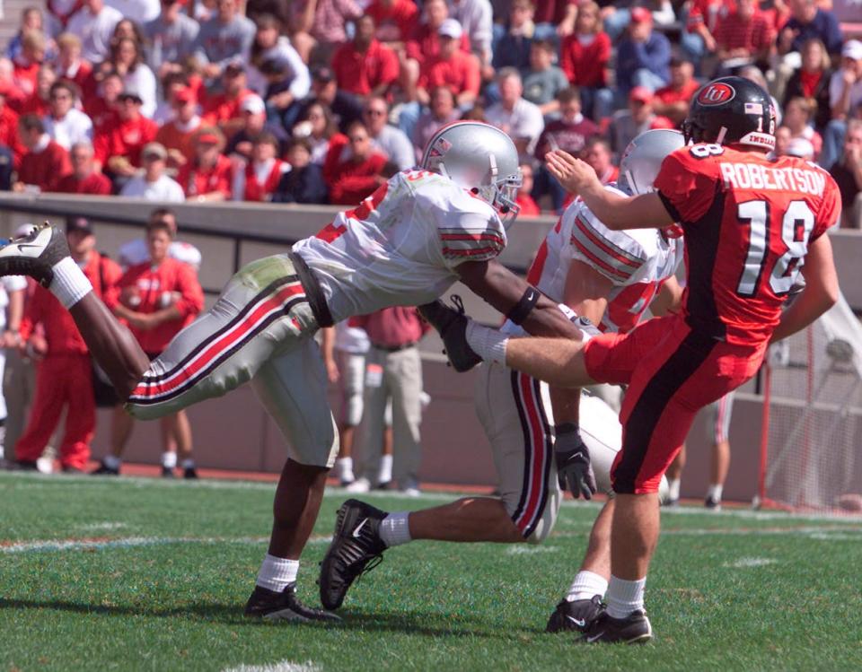 Mike Doss blocks an Indiana punt by Bryan Robertson during the third quarter, Saturday, Sept. 29, 2001. The blocked punt was recovered by OSU's Will Allen.