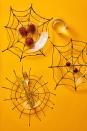 <p>Make spider web placemats, which can be made from parchment paper and puff paint, part of your centerpiece. Use the puff paint to create a web shape on the parchment paper. Once it dries overnight, peel the paper off the back. You can then place them under clear plates and rest pumpkins, flowers, or desserts on top for a creative centerpiece. </p><p><a class="link " href="https://go.redirectingat.com?id=74968X1596630&url=https%3A%2F%2Fwww.michaels.com%2Fpuffy-dimensional-fabric-paint-1.25oz-black%2F10181892.html&sref=https%3A%2F%2Fwww.goodhousekeeping.com%2Fholidays%2Fhalloween-ideas%2Fg33437890%2Fhalloween-table-decorations-centerpieces%2F" rel="nofollow noopener" target="_blank" data-ylk="slk:SHOP PUFF PAINT;elm:context_link;itc:0;sec:content-canvas">SHOP PUFF PAINT</a></p>