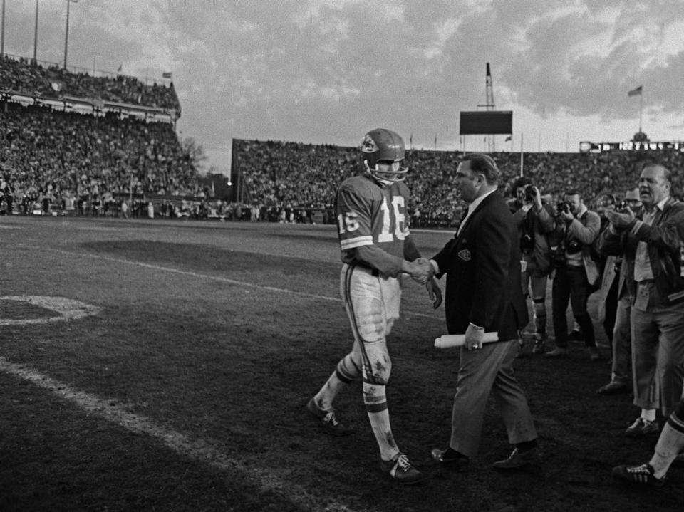 Kansas City Chiefs head coach Hank Stram congratulating Len Dawson as he comes off the field during Super Bowl IV. Dawson was named MVP for his performance during the game.