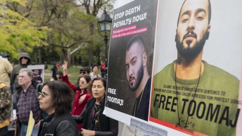 Protesters in New York City hold up signs saying FREE TOOMAJ and STOP DEATH PENALTY NOW.