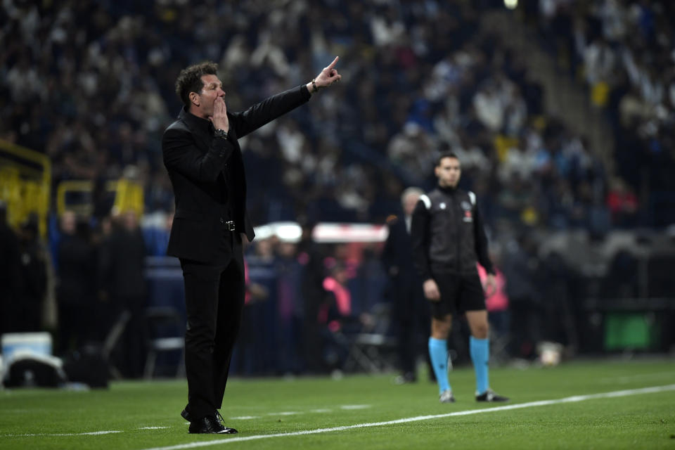 Atletico Madrid's head coach Diego Simeone shouts from the touchline during the Spanish Super Cup semi final soccer match between Real Madrid and Atletico Madrid at Al Awal Park Stadium in Riyadh, Saudi Arabia, Wednesday, Jan. 10, 2024. (AP Photo)