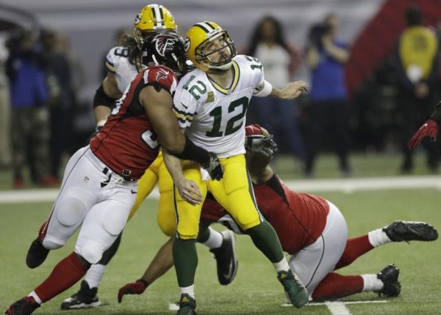 Aaron Rodgers, Packers manage more magic, control playoff fate into finale  - The Boston Globe