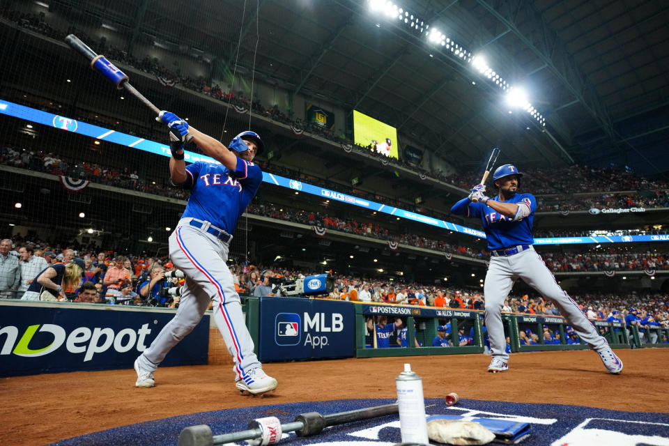 HOUSTON, TX - OCTOBER 15:   Corey Seager #5 and Marcus Semien #2 of the Texas Rangers prepare to bat in the first inning during during Game 1 of the ALCS between the Texas Rangers and the Houston Astros at Minute Maid Park on Sunday, October 15, 2023 in Houston, Texas. (Photo by Daniel Shirey/MLB Photos via Getty Images)