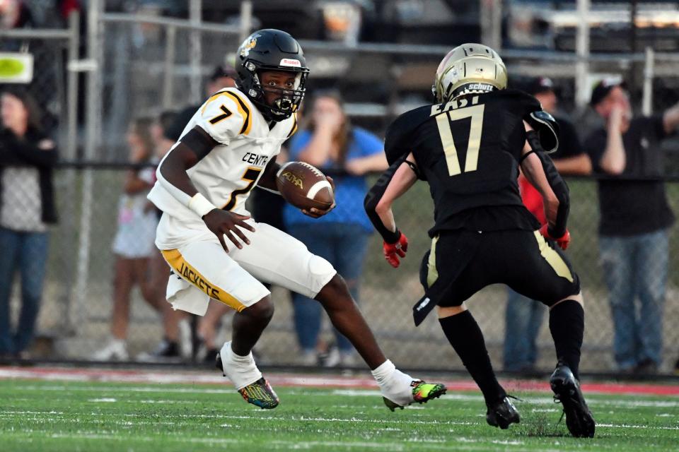 Central's Steven Smith (7) tries to avoid the defense of Bullitt East's Bryce Elder (17) during the first half of the game, Friday, September 15, 2023, at Mount Washington Ky.