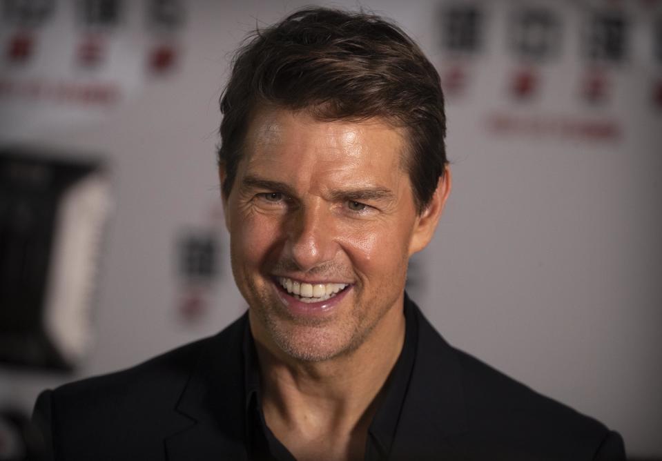 Tom Cruise smiles as he gives an interview during a red carpet event for the movie "Mission: Impossible - Fallout" at the Imperial Ancestral Temple in Beijing, China, Wednesday, Aug. 29, 2018. The film opens in China on Aug. 31. (AP Photo/Mark Schiefelbein)