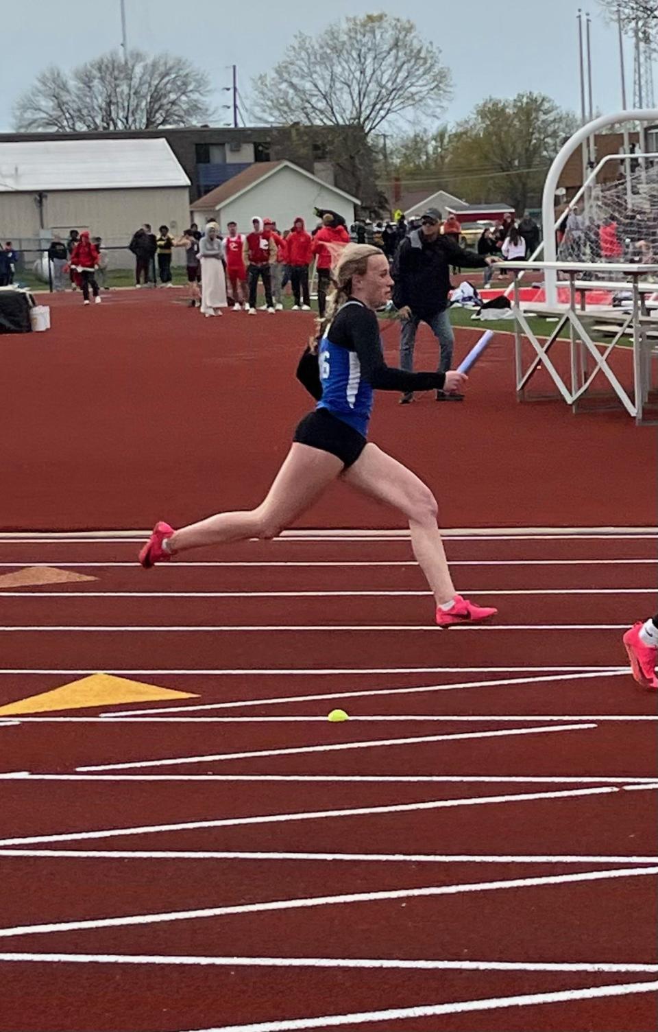 Clyde's Bree Caudill runs her leg of a relay.