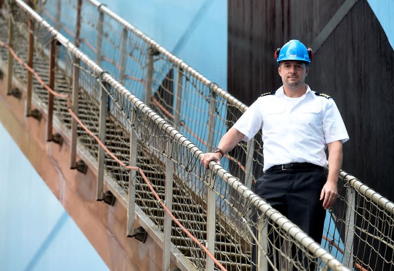 Captain Jens Boysen gives an interview in front of the Maersk Line container ship "Emma Maersk" during the spread of the coronavirus disease (COVID-19) in the harbour in Hamburg