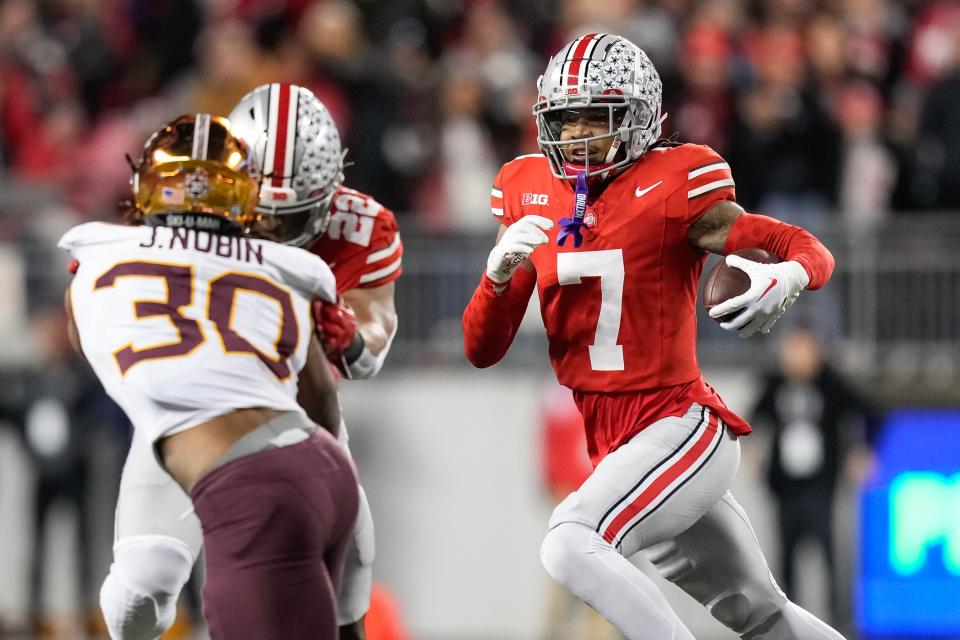 Nov 18, 2023; Columbus, Ohio, USA; Ohio State Buckeyes cornerback Jordan Hancock (7) gets a block from linebacker Steele Chambers (22) on Minnesota Golden Gophers running back Jordan Nubin (30) as he returns an interception during the NCAA football game at Ohio Stadium.