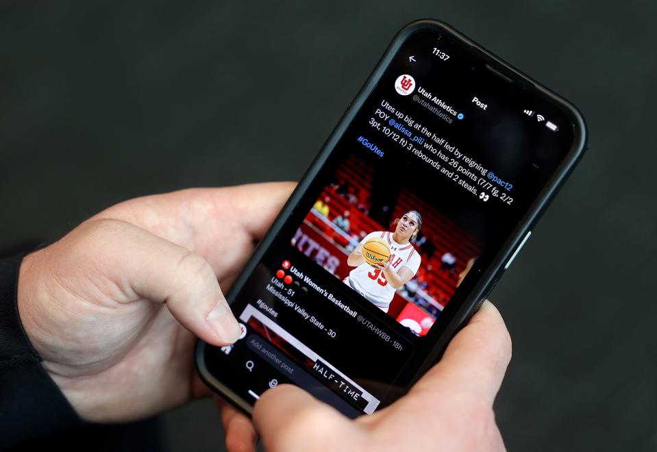 Nick Bolerjack, University of Utah Athletics director of social media, shows a recent Utah Athletics social media post on his phone at the Spence and Cleone Eccles Football Center in Salt Lake City on Tuesday, Nov. 7, 2023. | Kristin Murphy, Deseret News