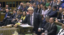 Prime Minister Boris Johnson speaks to lawmakers during Prime Minister's Questions in the House of Commons, London, Wednesday Oct. 23, 2019. The government is now waiting for the EU's response to its request for a three-month extension to the Brexit deadline, as Prime Minister Johnson appeared to be pushing Wednesday for an early General Election. (House of Commons via AP)