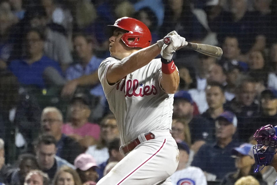 Philadelphia Phillies' J.T. Realmuto watches his single off Chicago Cubs starting pitcher Alec Mills during the sixth inning of a baseball game Wednesday, July 7, 2021, in Chicago. (AP Photo/Charles Rex Arbogast)