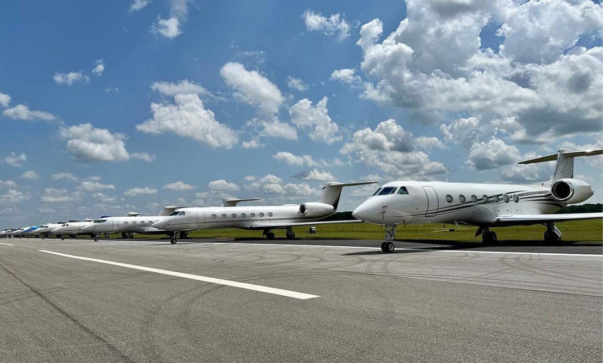 Private jets are seen parked on the runway at Augusta Regional Airport.