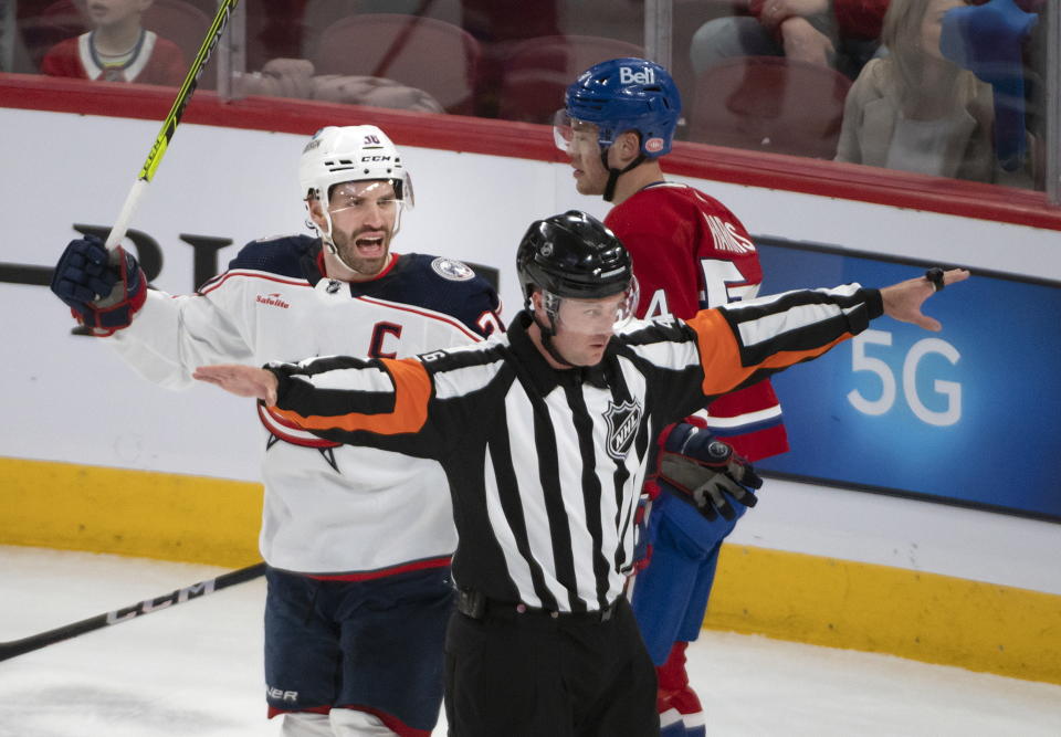 Columbus Blue Jackets Boone Jenner reacts to a no goal call by the referee during the first period of an NHL hockey game against the Montreal Canadiens in Montreal, Saturday, March 25, 2023. (Peter McCabe/The Canadian Press via AP)