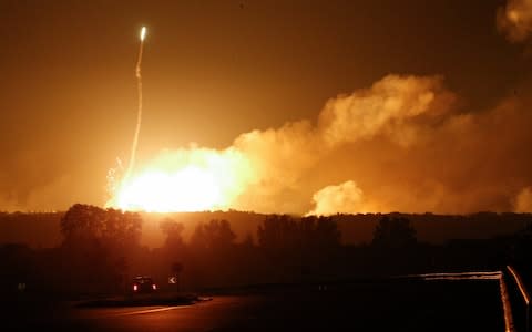 The depot stored thousands of artillery shells and missiles for multiple rocket launch systems.  - Credit: SERGEY DOLZHENKO/EPA