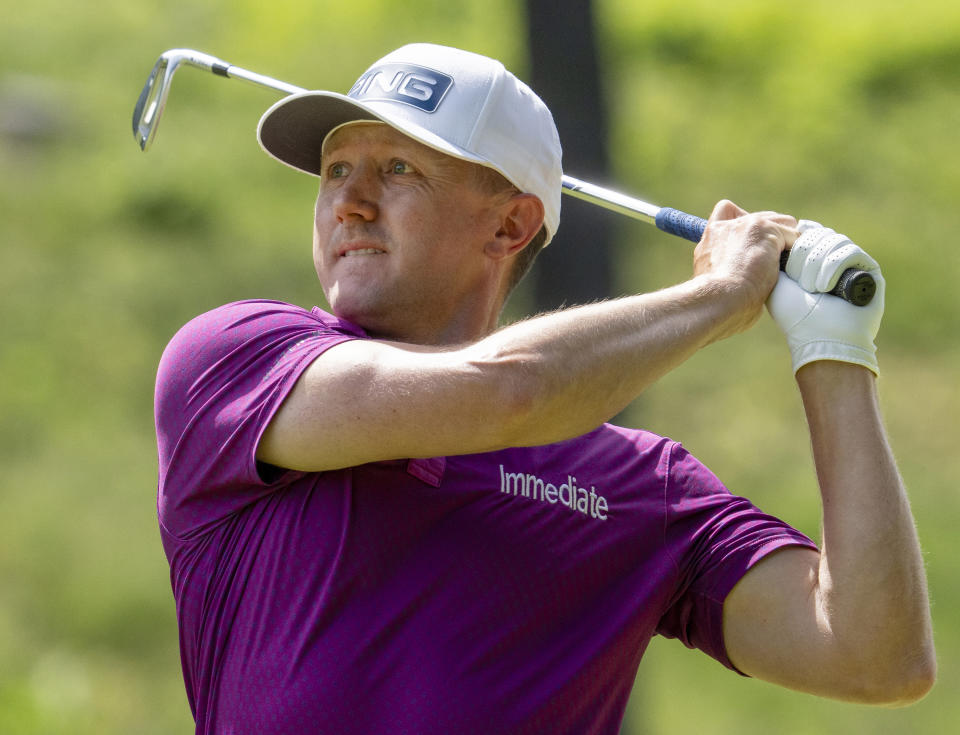 Mackenzie Hughes watches his approach shot on the third hole during the third round of Canadian Open golf tournament in Hamilton, Ontario, Saturday, June 1, 2024. (Frank Gunn/The Canadian Press via AP)