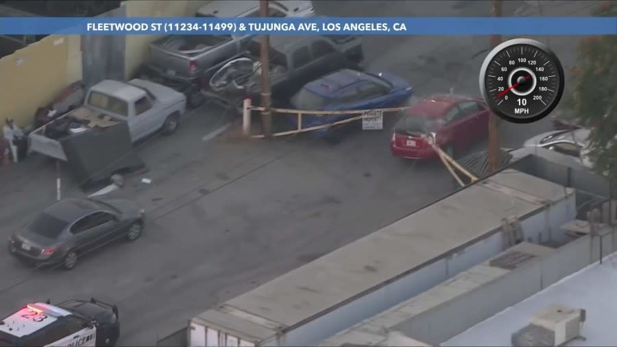 The suspect turned onto a dead-end street and rammed a metal gate. (KTLA)