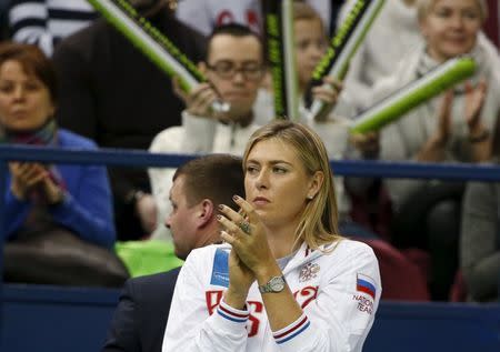 Russia's Maria Sharapova reacts as she watches compatriot Ekaterina Makarova play against Kiki Bertens of the Netherlands during their Fed Cup World Group tennis match in Moscow, February 6, 2016. REUTERS/Grigory Dukor