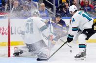May 21, 2019; St. Louis, MO, USA; St. Louis Blues center Brayden Schenn (10) chases a loose puck while defended by San Jose Sharks center Gustav Nyquist (right) and goaltender Martin Jones (left) during the second period in game six of the Western Conference Final of the 2019 Stanley Cup Playoffs at Enterprise Center. Mandatory Credit: Jeff Curry-USA TODAY Sports