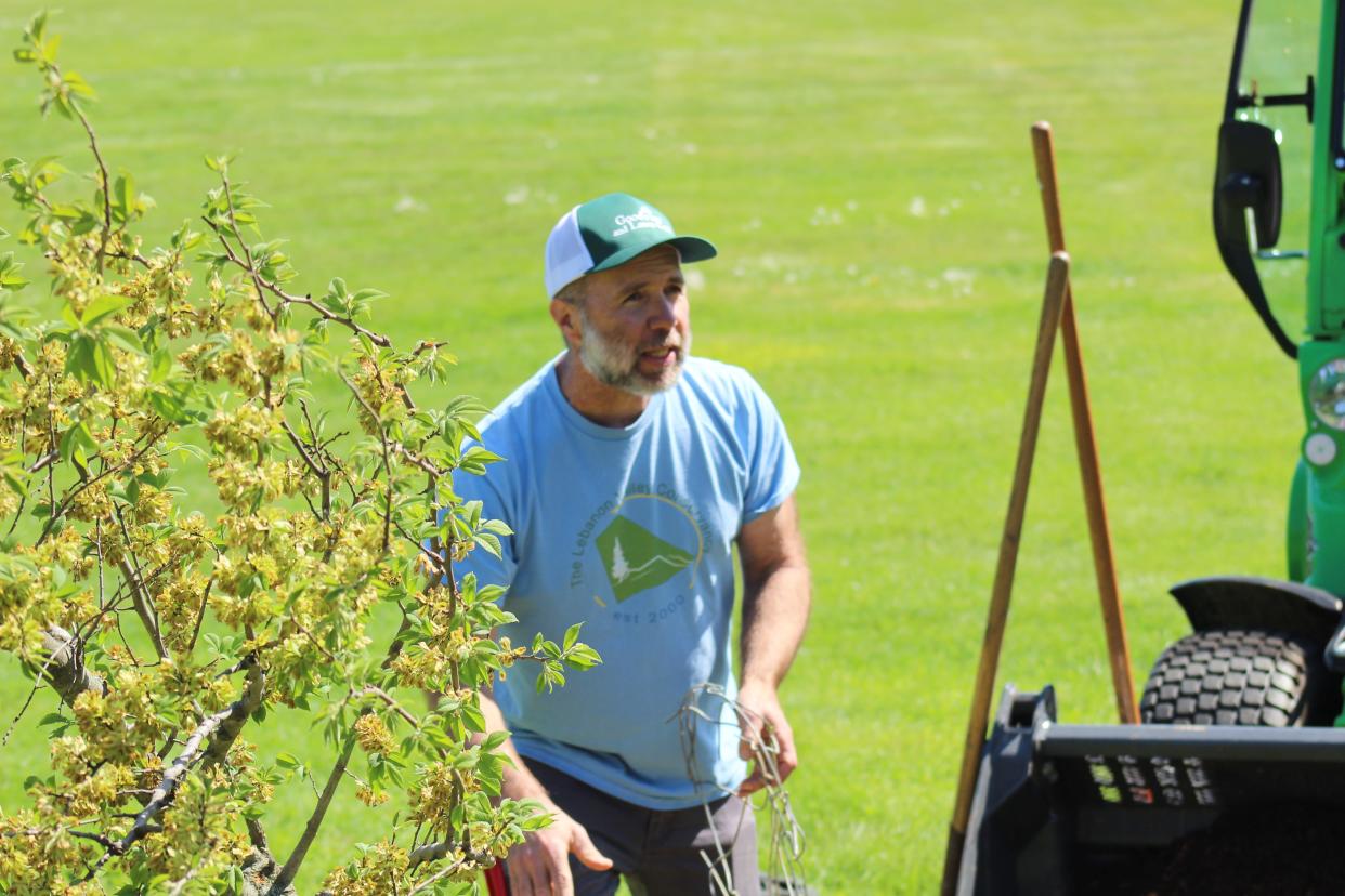 Jon Schach, president of The Lebanon Valley Conservancy and general manager at Good's Tree and Lawn Care, have a presentation useful tips in tree planting while the tree was being planted.