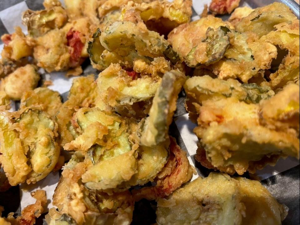 Pickles, pepperoncini rings and red bell peppers are coated in a light batter, fried and served at Boston's in the Arena District.