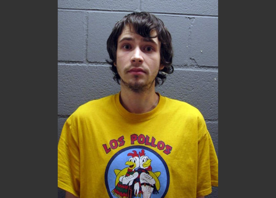 In this undated booking photo provided by the Cook County Sheriff's Office, Daniel Kowalski, a suburban Chicago man accused of operating a methamphetamine lab, wears a t-shirt for the fictional Los Pollos Hermanos chicken restaurant depicted in "Breaking Bad," a show about a methamphetamine manufacturer. Kowalski, 21, is charged with felony possession of a controlled substance, methamphetamine manufacturing materials and precursors. (AP Photo/Cook County Sheriff's Office)