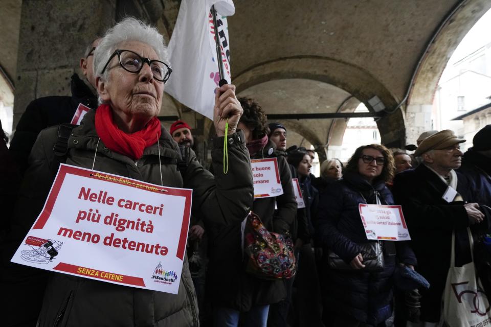 People gather to raise awareness of the case of the Italian antifascist activist Ilaria Salis detained in Hungary, in Milan, Italy, Saturday, Feb. 10, 2024. Italy has ramped up its protests over the treatment of Salis being held in a Hungarian jail after images of her appearing chained and shackled at a Budapest court hearing. (AP Photo/Luca Bruno)