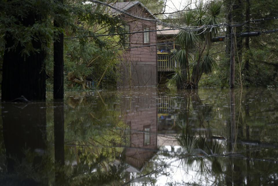 A home is seen reflected in the flood waters of the Russian River in Forestville, Calif., on Feb. 27, 2019. (Photo: Michael Short/AP)
