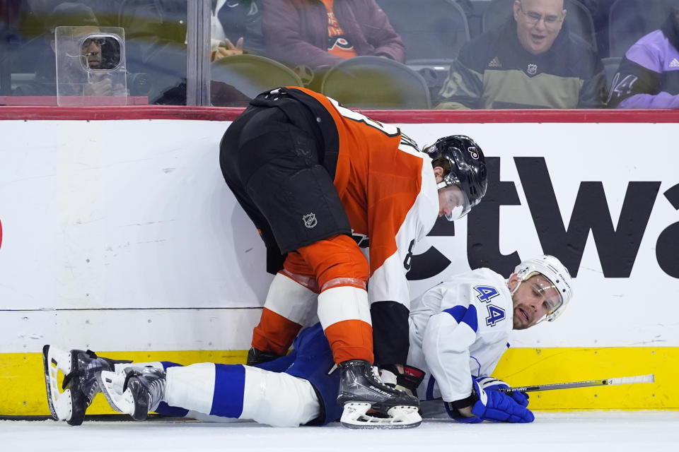 Philadelphia Flyers' Cam York, top, collides with Tampa Bay Lightning's Calvin de Haan during the second period of an NHL hockey game, Tuesday, Jan. 23, 2024, in Philadelphia. (AP Photo/Matt Slocum)