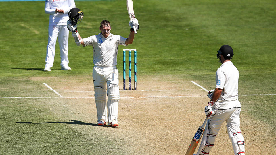 Tom Latham celebrates his double century. (Photo by Hagen Hopkins/Getty Images)