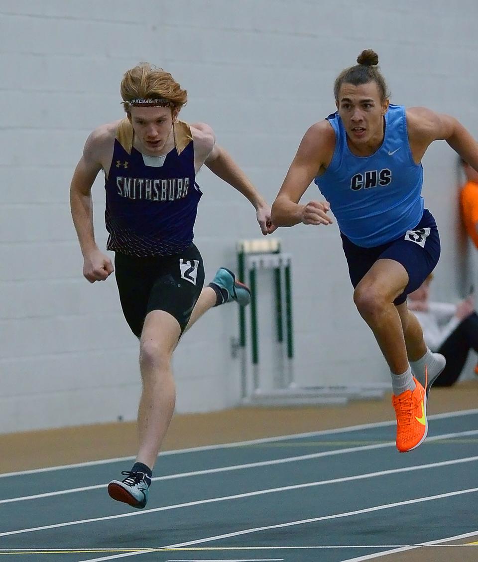 Smithsburg's Cameron Rejonis, left, and Catoctin's Furious Trammel cross the finish line in the 500-meter dash during the Maryland Class 1A West Indoor Track & Field Championships.