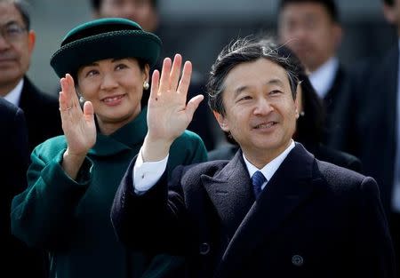 FILE PHOTO: Japan's Crown Prince Naruhito (R) and and his wife Crown Princess Masako wave as they send off Emperor Akihito and Empress Michiko boarding a special flight for their visit to Vietnam and Thailand, at Haneda Airport in Tokyo, Japan February 28, 2017. REUTERS/Issei Kato/File Photo