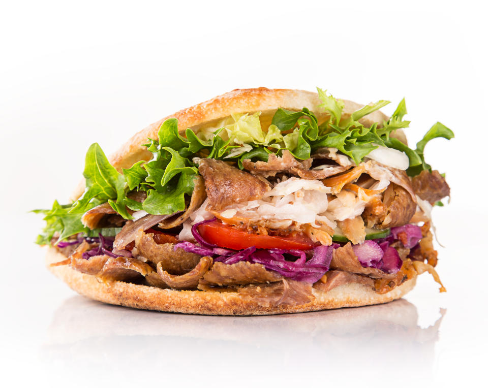 close up of kebab sandwich on white background