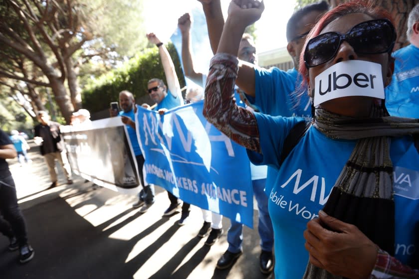 Genaro Molina  Los Angeles Times UBER AND LYFT driver Teresa Mercado, right, joins members of the Mobile Workers Alliance, which consists of Uber and Lyft drivers, protesting at the home of Uber co-founder Garrett Camp in Beverly Hills.