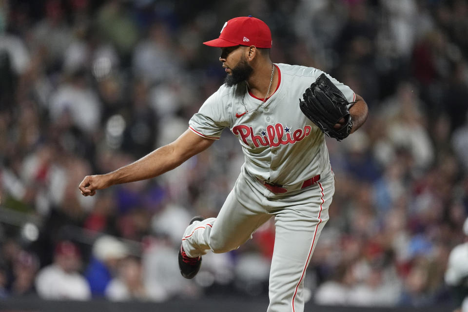 Philadelphia Phillies relief pitcher Seranthony Domínguez works against the Colorado Rockies in the seventh inning of a baseball game Saturday, May 25, 2024, in Denver. (AP Photo/David Zalubowski)