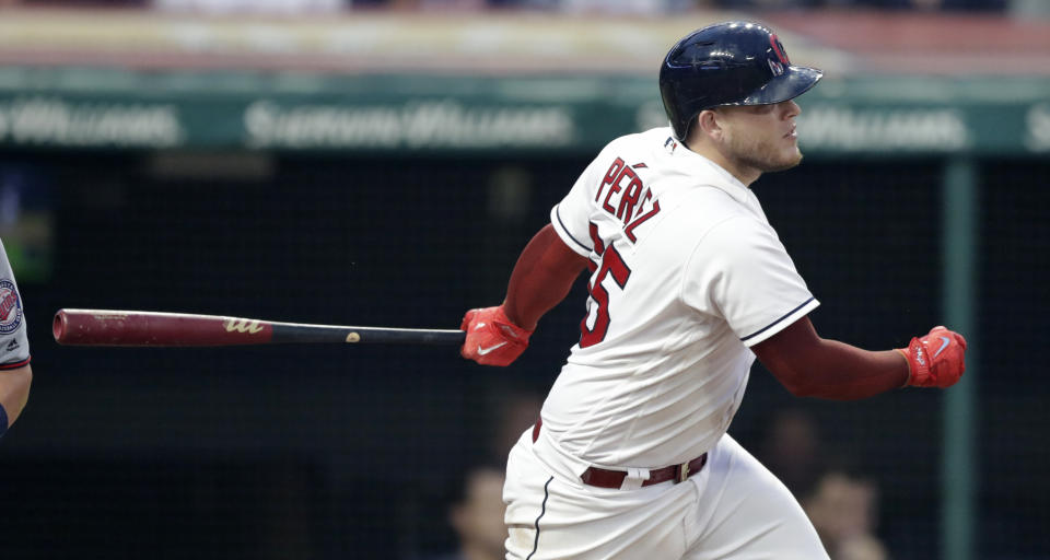 Cleveland Indians' Roberto Perez hits a one-run double off Minnesota Twins starting pitcher Kyle Gibson in the fourth inning of a baseball game, Monday, Aug. 6, 2018, in Cleveland. Jason Kipnis scored on the play. (AP Photo/Tony Dejak)