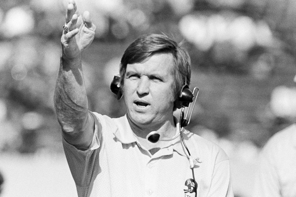 FILE - In this 1973 file photo, Pittsburgh NCAA college football coach Johnny Majors gestures from the sideline in Pittsburgh. Majors, the coach of Pittsburgh’s 1976 national championship team and a former coach and star player at Tennessee, has died. He was 85. Majors died Wednesday morning, June 3, 2020, at home in Knoxville, Tenn., according to a statement from his wife, Mary Lynn Majors. (AP Photo/Harry Cabluck, File)