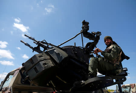 A member of Libyan National Army (LNA), commanded by Khalifa Haftar, is seen as he heads out of Benghazi to reinforce the troops advancing to Tripoli, in Benghazi, Libya April 7, 2019. REUTERS/Esam Omran Al-Fetori