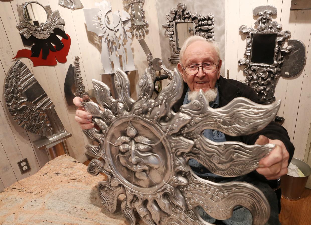 Artist Don Drumm shows one of his large sun sculptures at Don Drumm Studios & Gallery in Akron.